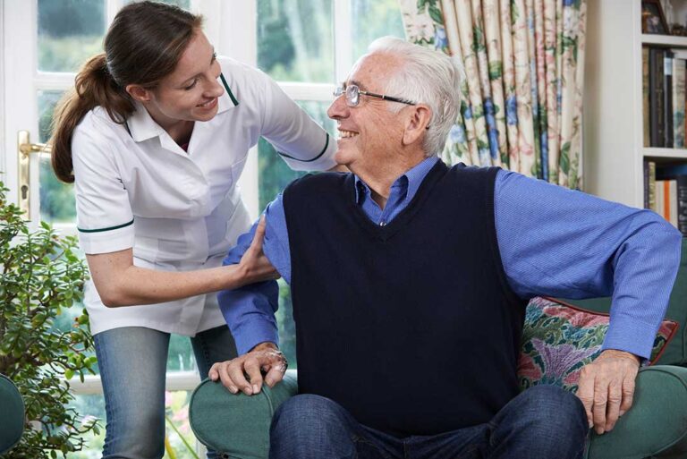 An older adult calmly packing belongings with supportive family members in a cozy living room.